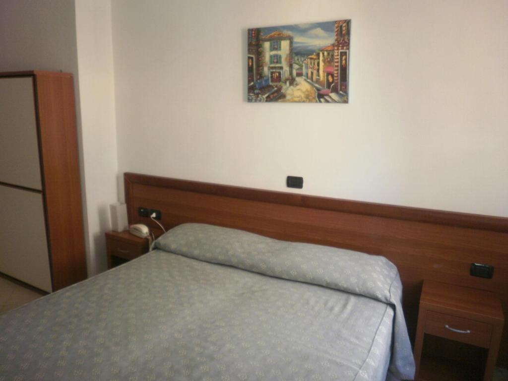 Postel nebo postele na pokoji v ubytování Albergo Posta