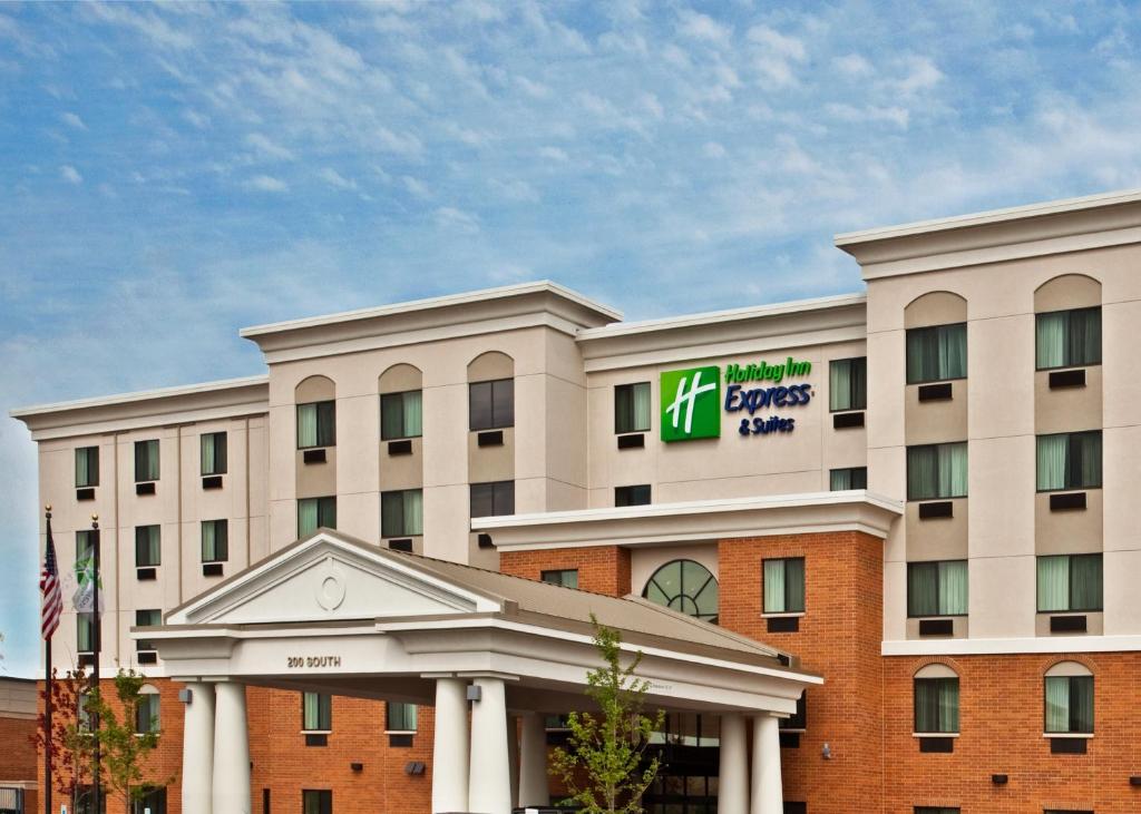 a hotel building with a sign on it at Holiday Inn Express & Suites Chicago West-O'Hare Arpt Area , an IHG Hotel in Hillside
