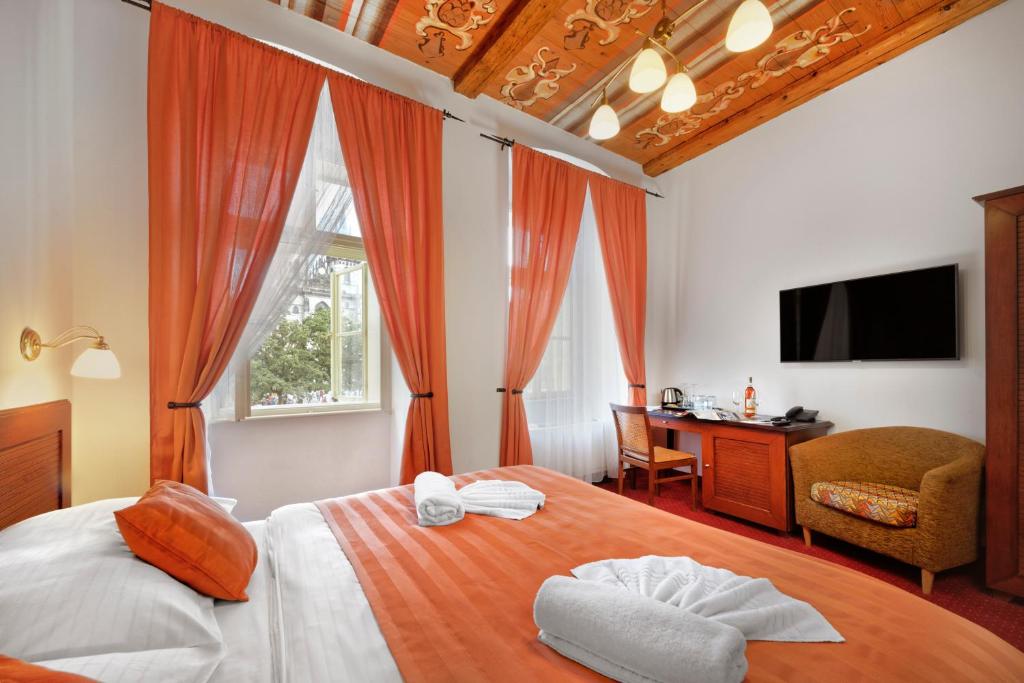 Postel nebo postele na pokoji v ubytování Hotel Lippert