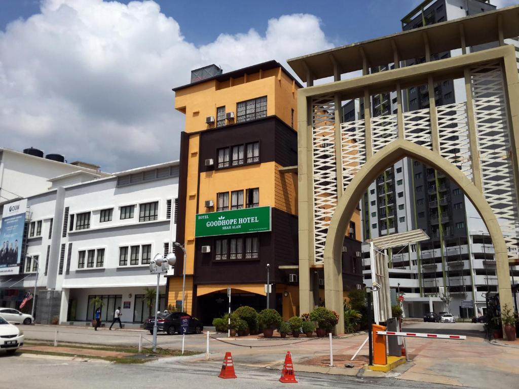 a building with an arch in front of a street at Goodhope Hotel Shah Alam in Shah Alam
