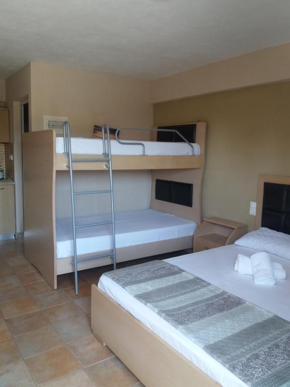 Postel nebo postele na pokoji v ubytování House Meltemi