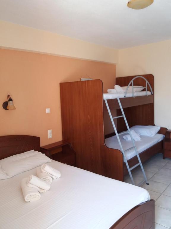 Postel nebo postele na pokoji v ubytování House Meltemi