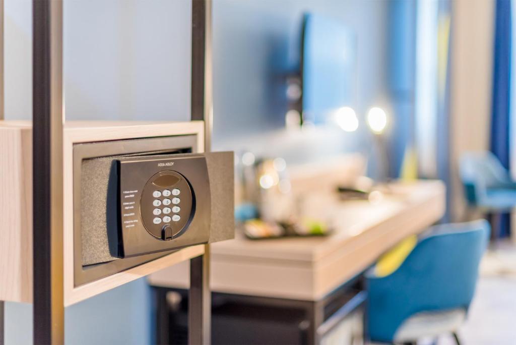 Postel nebo postele na pokoji v ubytování Impulso Fashion Hotel