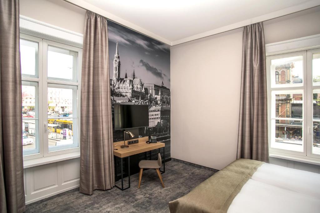 Postel nebo postele na pokoji v ubytování T62 Hotel