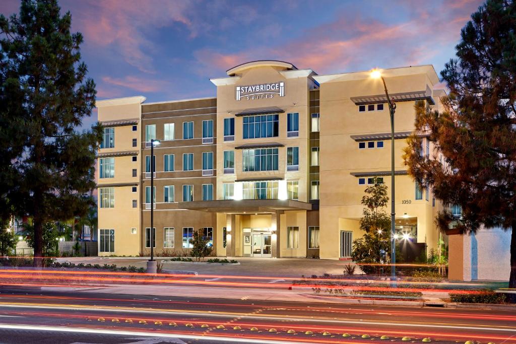 a large building with a clock on the front of it at Staybridge Suites Anaheim At The Park, an IHG Hotel in Anaheim