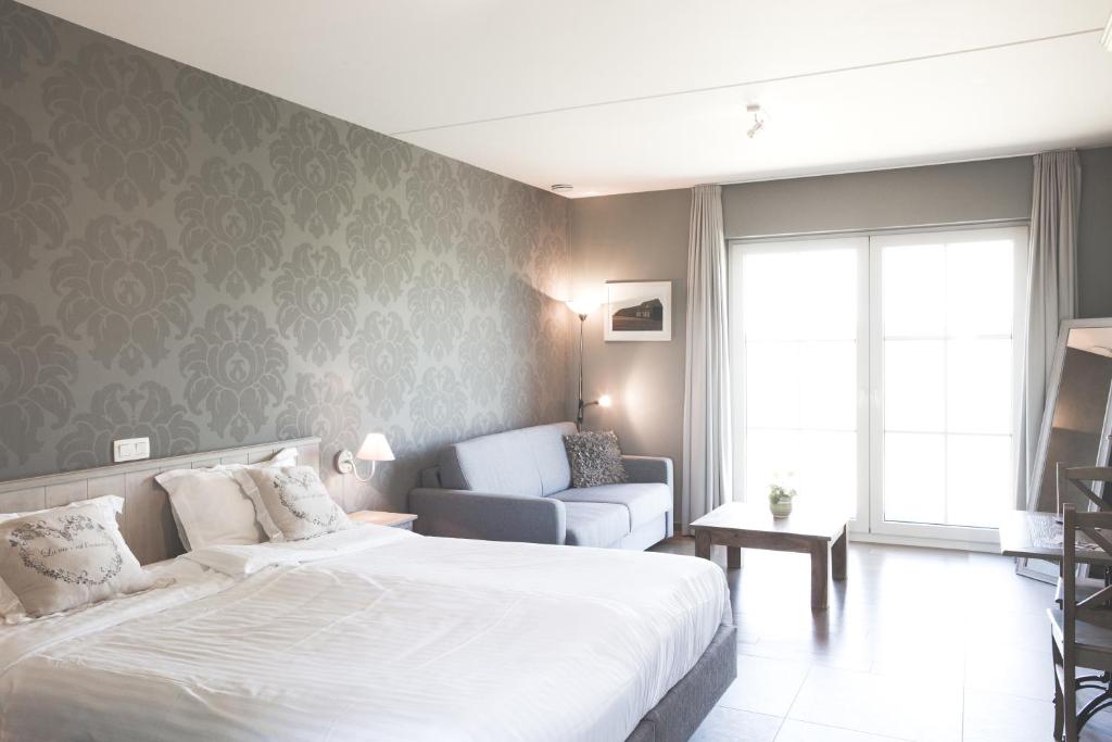 Postel nebo postele na pokoji v ubytování B&B Nieuwhof