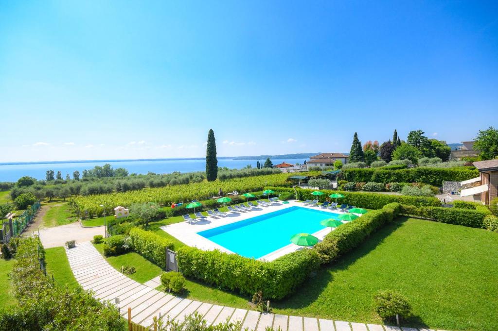an aerial view of a garden with a swimming pool at Residence Corte Ferrari -Ciao Vacanze- in Moniga