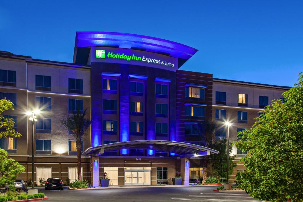 
a large building with a clock on the front of it at Holiday Inn Express & Suites Anaheim Resort Area, an IHG Hotel in Anaheim

