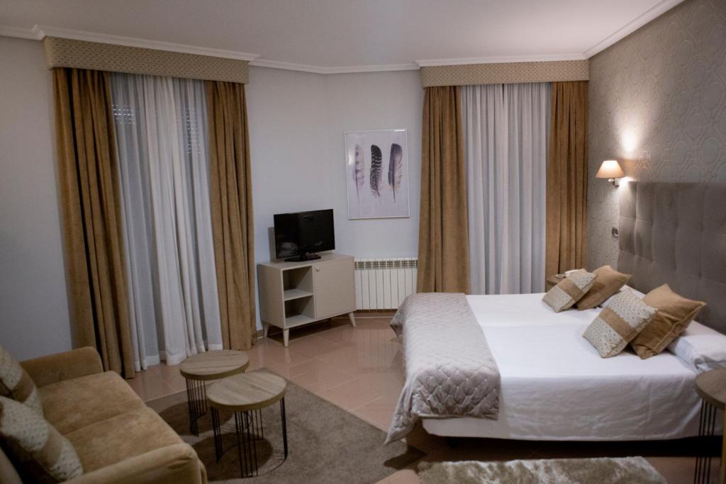 Postel nebo postele na pokoji v ubytování Hotel Las Moradas