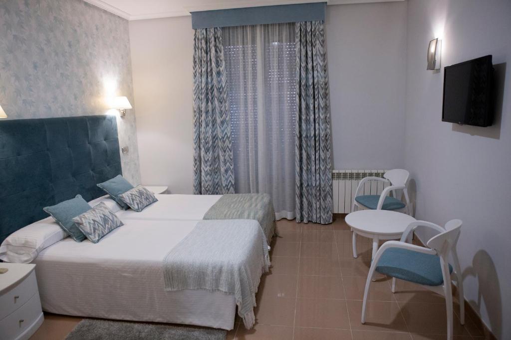 Postel nebo postele na pokoji v ubytování Hotel Las Moradas