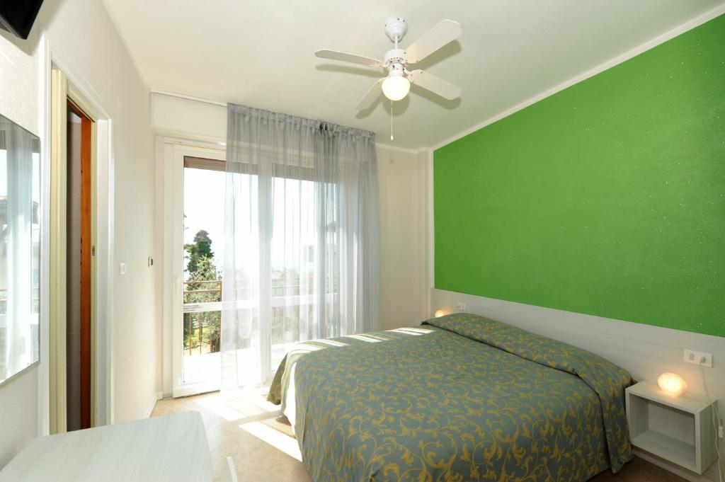 Postel nebo postele na pokoji v ubytování Hotel Villa Grazia