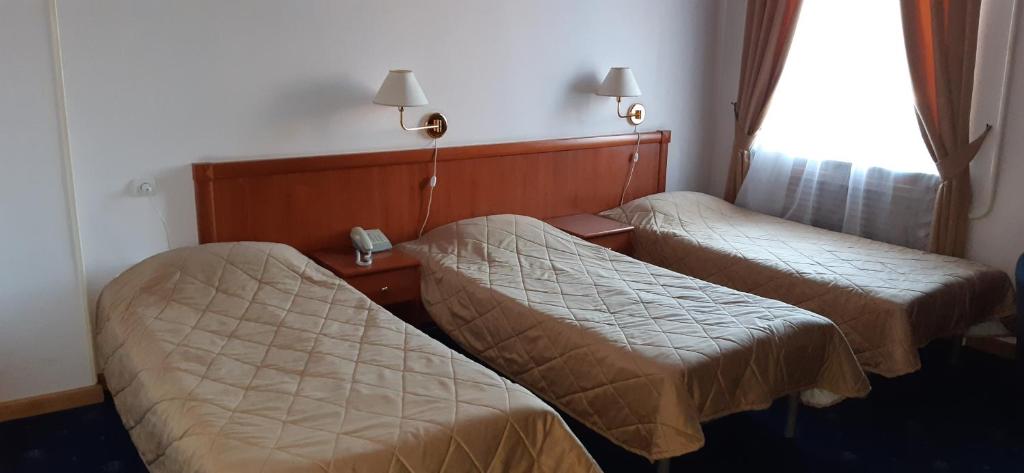 Postel nebo postele na pokoji v ubytování Araks Hotel Complex