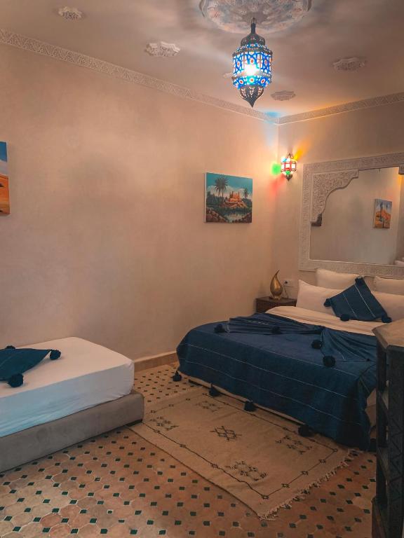 Postel nebo postele na pokoji v ubytování Riad Ghali Hotel & SPA