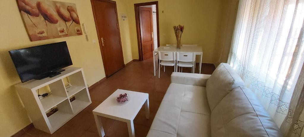 Televízia a/alebo spoločenská miestnosť v ubytovaní Apartamento Cielo 35