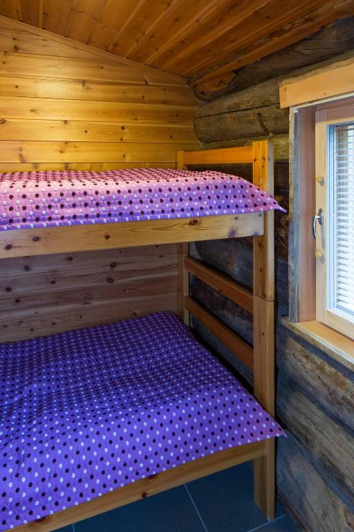 Кровать или кровати в номере Holiday Club Salla Apartments