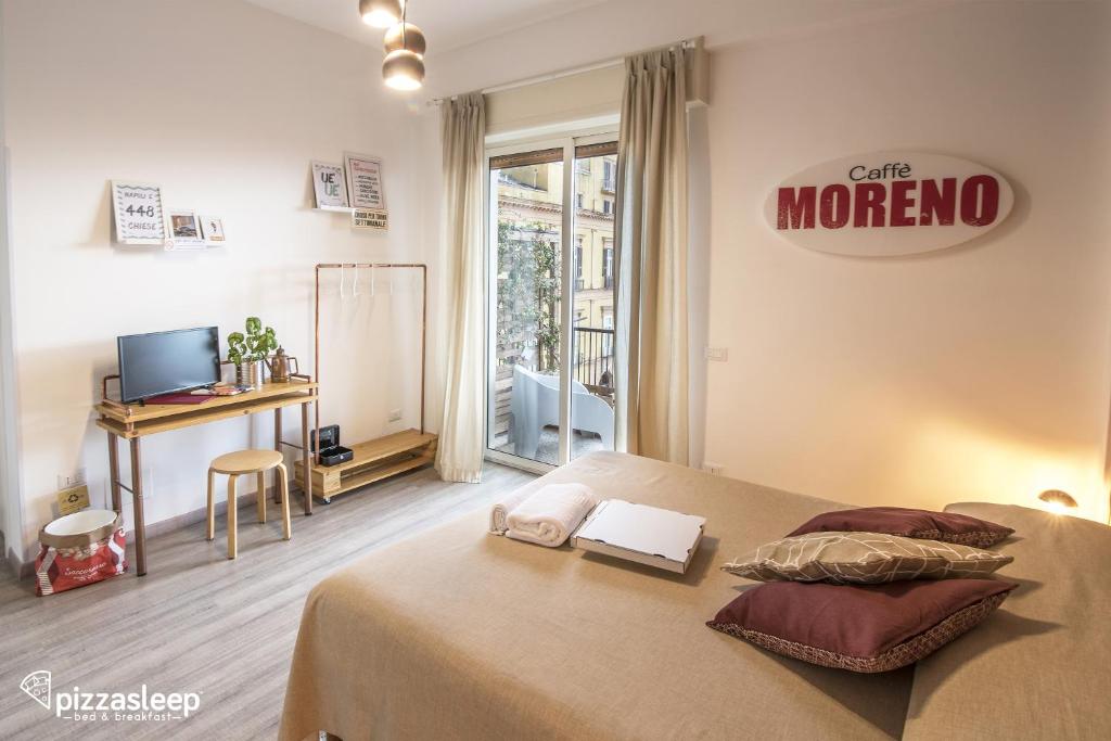 Postel nebo postele na pokoji v ubytování PizzaSleep B&B
