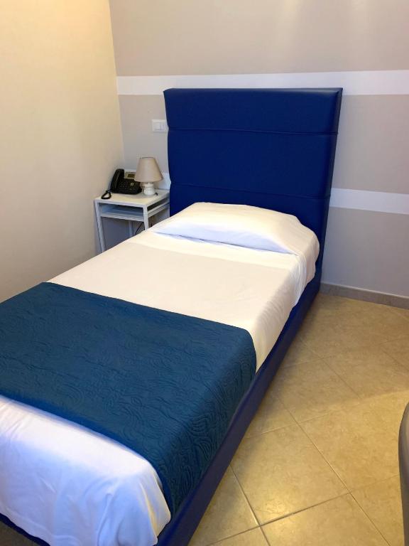 Postel nebo postele na pokoji v ubytování Albergo Ristorante del Cacciatore