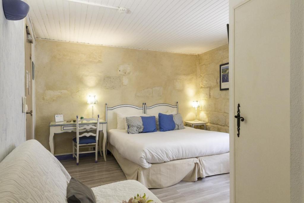 Postel nebo postele na pokoji v ubytování Hotel Boquier