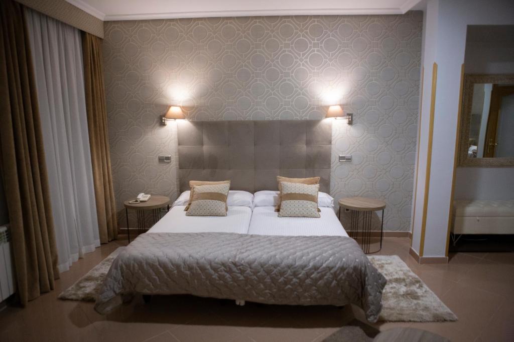 Postel nebo postele na pokoji v ubytování Hotel Las Moradas