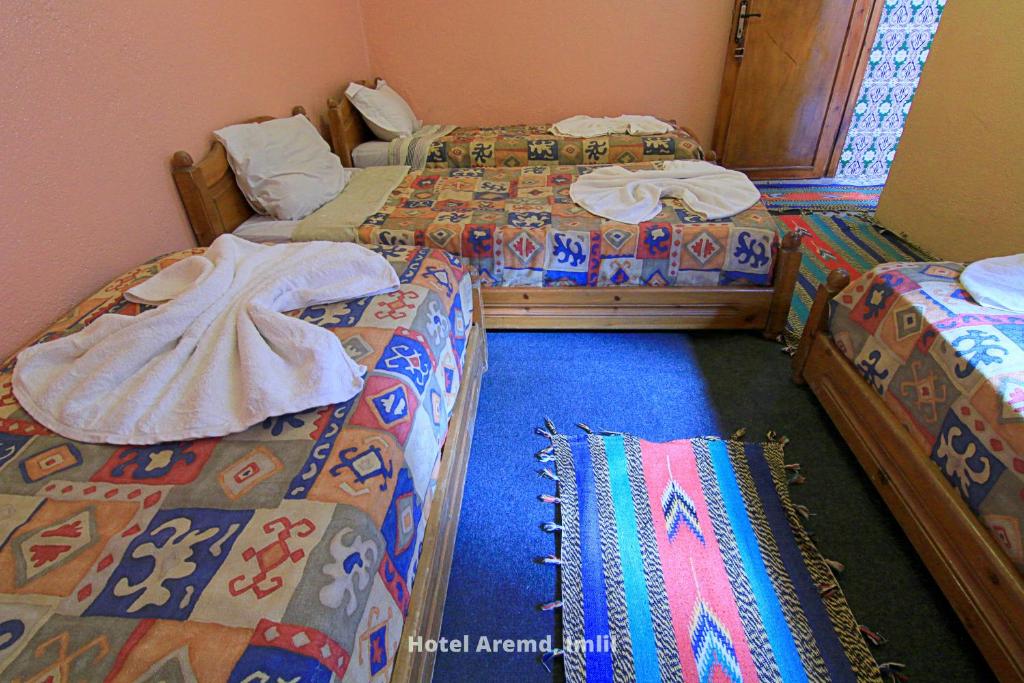 Postel nebo postele na pokoji v ubytování Hotel Igoudar Armed