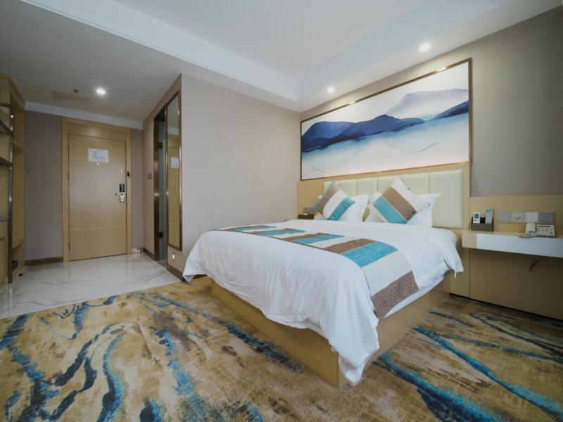 Cama ou camas em um quarto em VX Nanning Wuyi Road Hotel