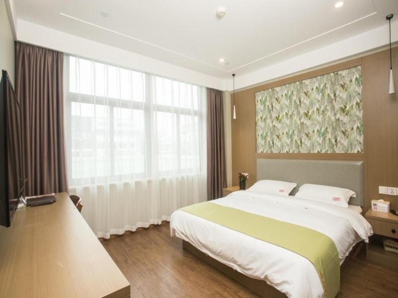 Krevet ili kreveti u jedinici u okviru objekta Shell Changzhou Yangrong City Hotel