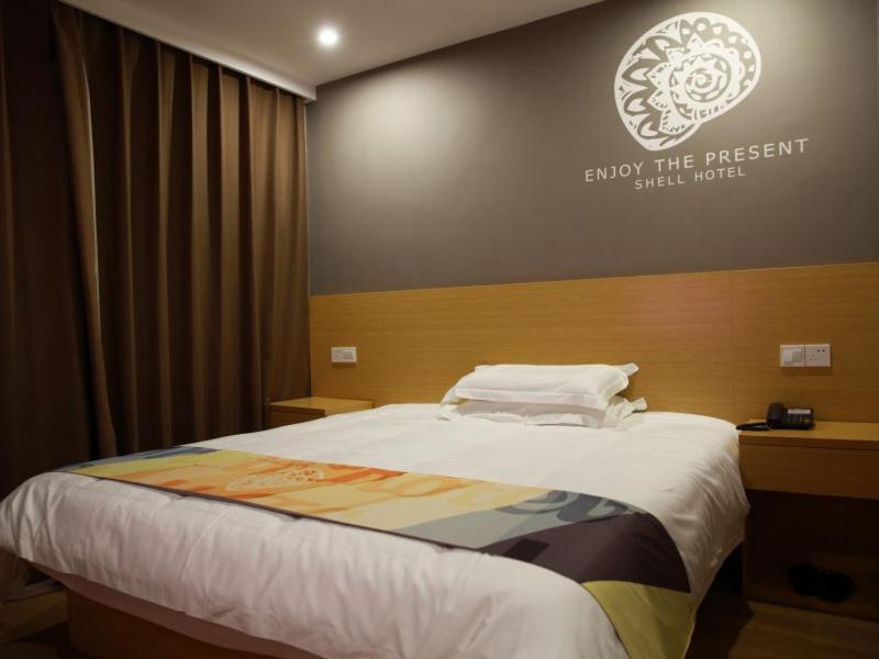 Postel nebo postele na pokoji v ubytování Shell Ningbo Yuyao Xinjian Road Hotel
