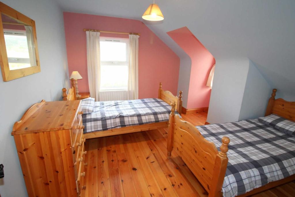 Postel nebo postele na pokoji v ubytování Rathmullan Holiday Homes