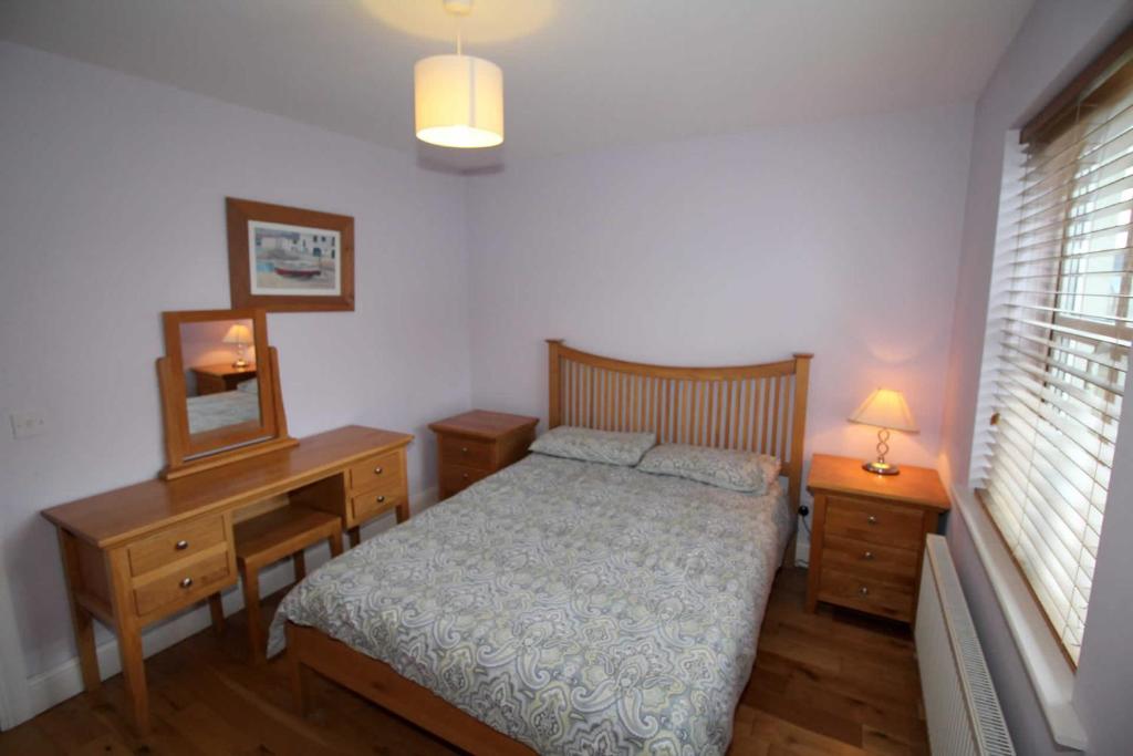 Postel nebo postele na pokoji v ubytování Rathmullan Holiday Homes