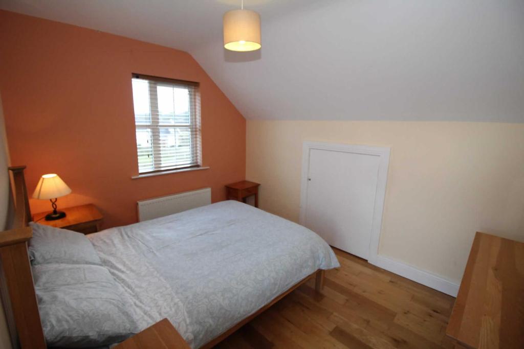Postel nebo postele na pokoji v ubytování Rathmullan Holiday Homes