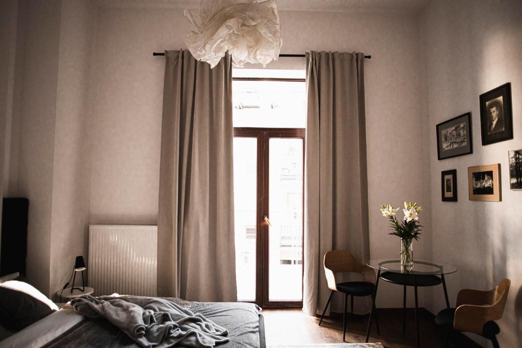 Posteľ alebo postele v izbe v ubytovaní Vilao Apartments