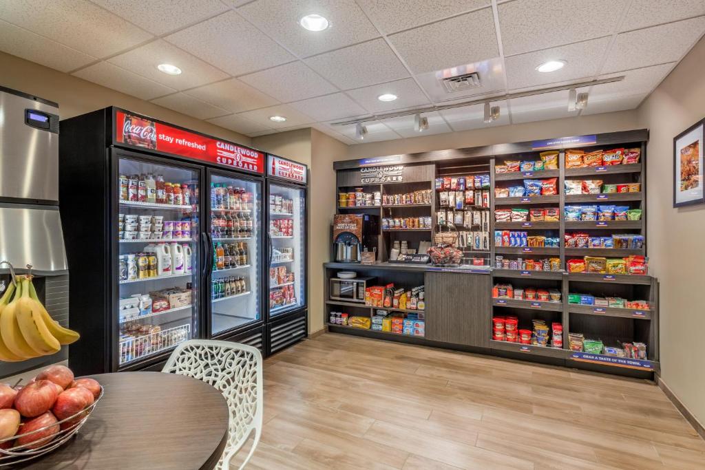 a grocery store with a table and shelves of food at Candlewood Suites Bethlehem South by IHG in Bethlehem