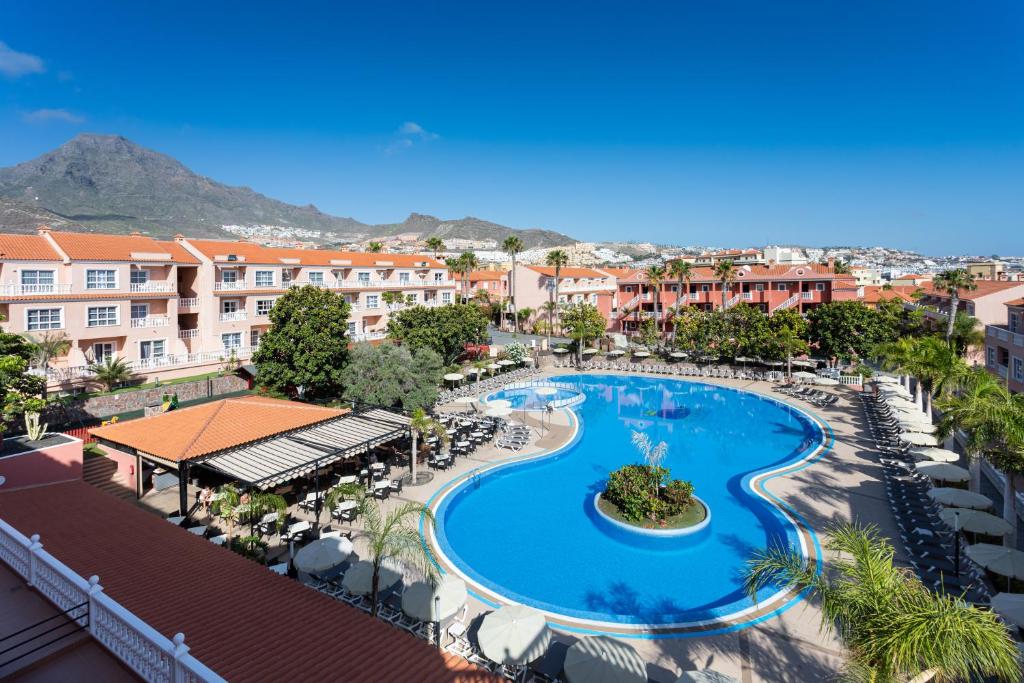 an aerial view of a resort with a swimming pool at Hotel El Duque in Adeje