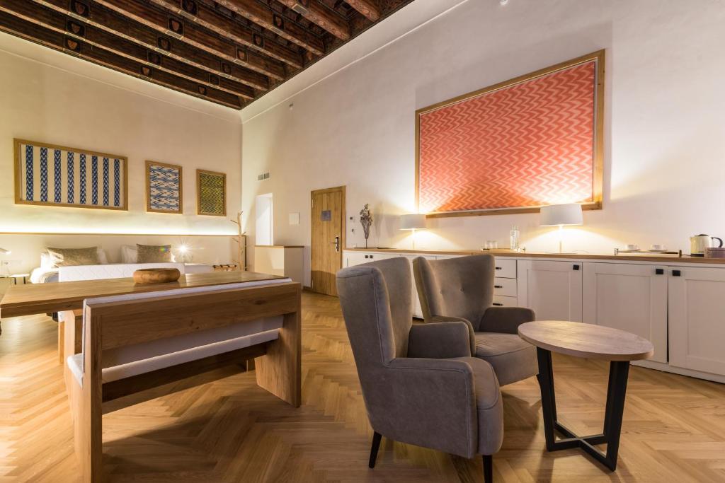 a kitchen and living room with a piano and a bed at ICON Rosetó in Palma de Mallorca
