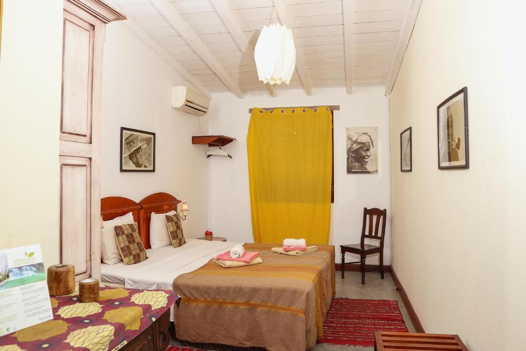 Postel nebo postele na pokoji v ubytování The Colonial Guest House