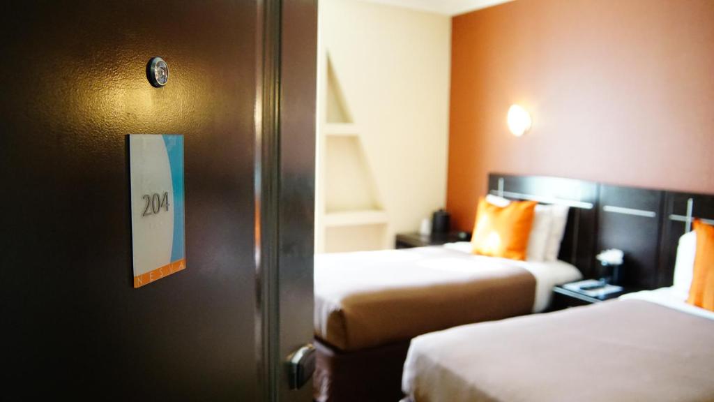 Postel nebo postele na pokoji v ubytování Nesva Hotel - New York City Vista