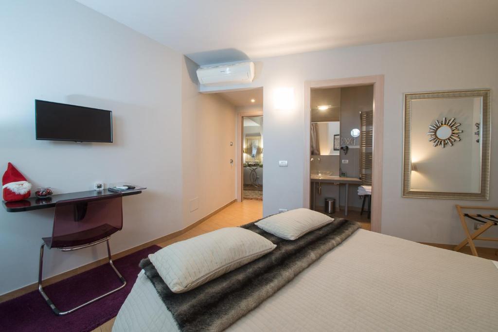 Postel nebo postele na pokoji v ubytování Residenza Ca' degli Enzi