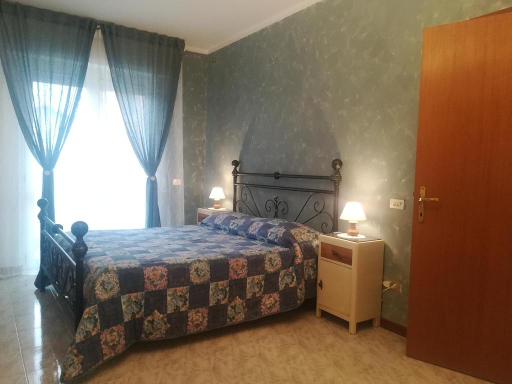 Postel nebo postele na pokoji v ubytování Affittacamere Giada