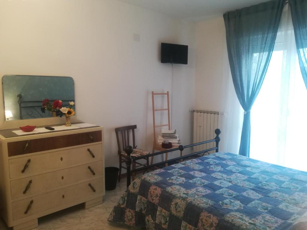 Postel nebo postele na pokoji v ubytování Affittacamere Giada