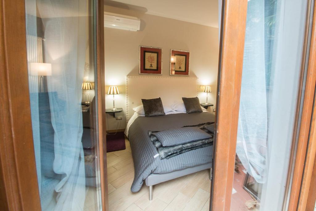 Postel nebo postele na pokoji v ubytování Residenza Ca' degli Enzi