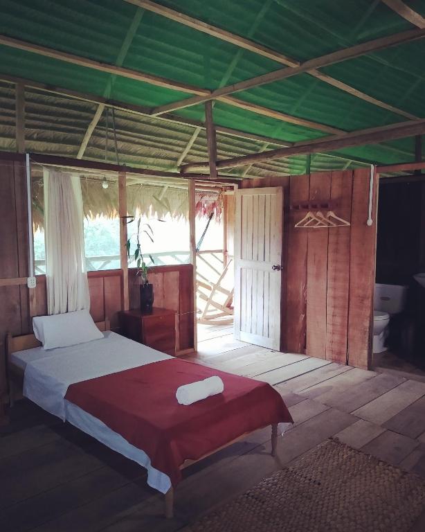 Postel nebo postele na pokoji v ubytování Casa Kukama Lodge