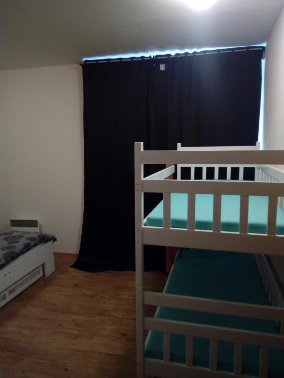Postel nebo postele na pokoji v ubytování Apartman29