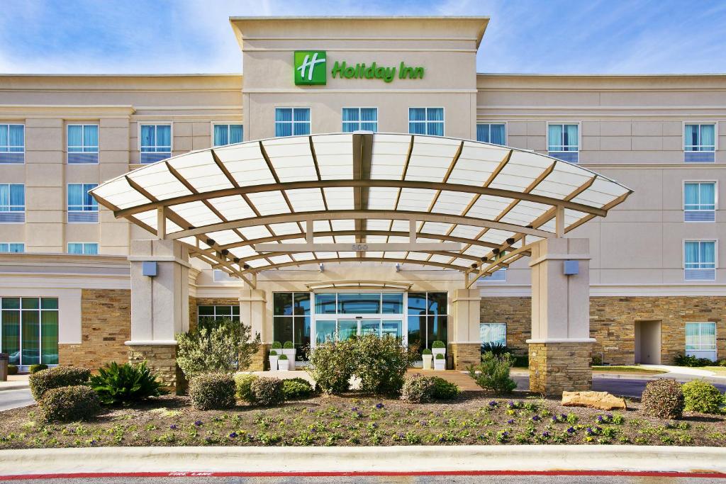 a hotel front of a building with awning at Holiday Inn Killeen Fort Hood, an IHG Hotel in Killeen