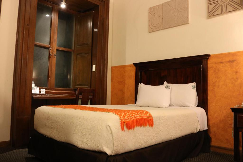 Postel nebo postele na pokoji v ubytování Hotel Historia