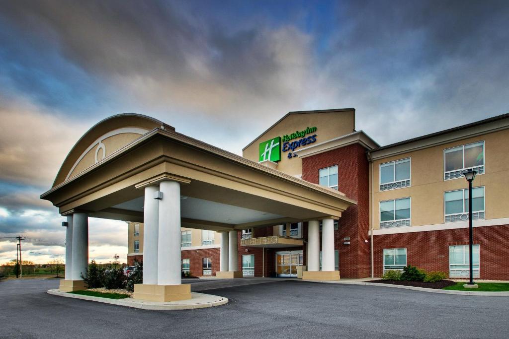 a hotel with a sign on top of a building at Holiday Inn Express & Suites Lancaster East - Strasburg, an IHG Hotel in Strasburg