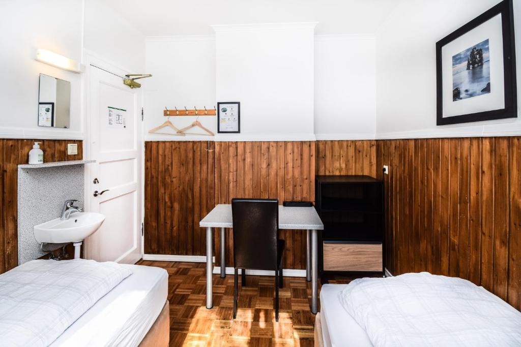 Postel nebo postele na pokoji v ubytování Guesthouse Aurora
