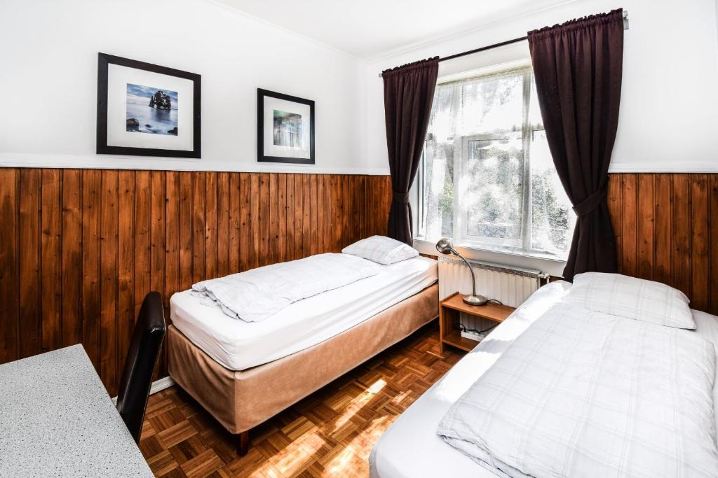 Postel nebo postele na pokoji v ubytování Guesthouse Aurora