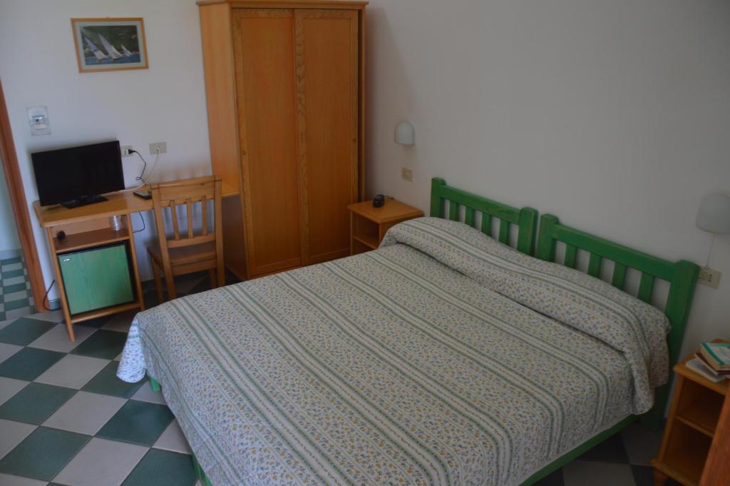 Postel nebo postele na pokoji v ubytování Guardia dei Mori
