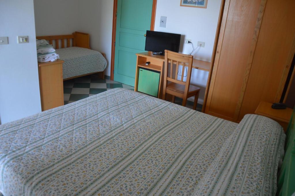 Postel nebo postele na pokoji v ubytování Guardia dei Mori