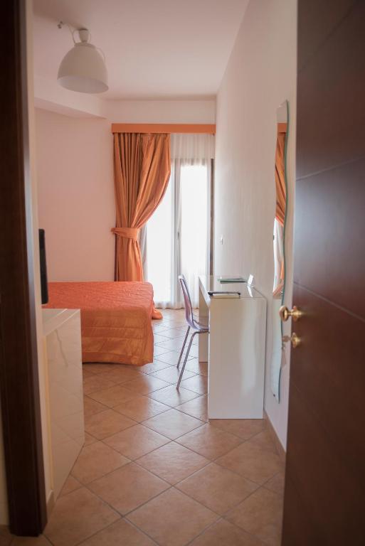 Postel nebo postele na pokoji v ubytování Hotel Caluna Charme